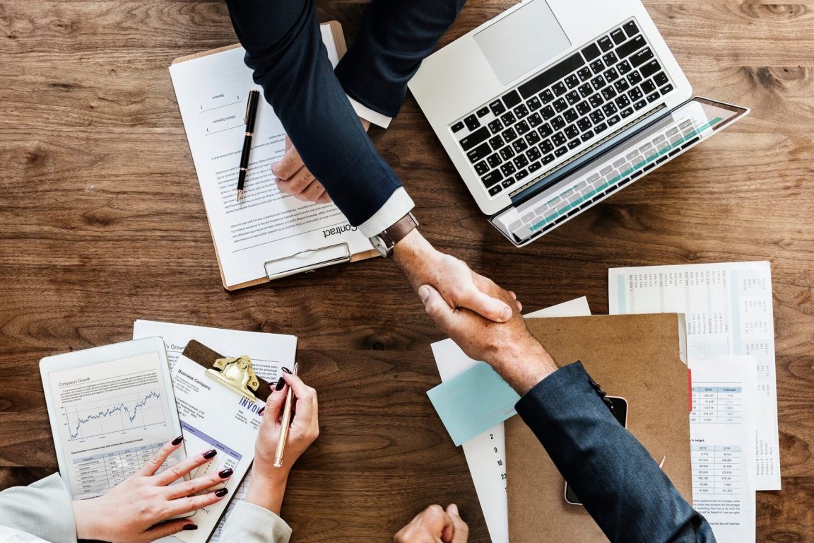 business-people-shaking-hands-together_53876-20488